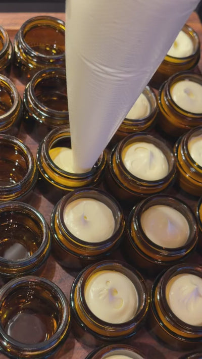 Lindsey's Whip being piped into 1 oz jars by hand