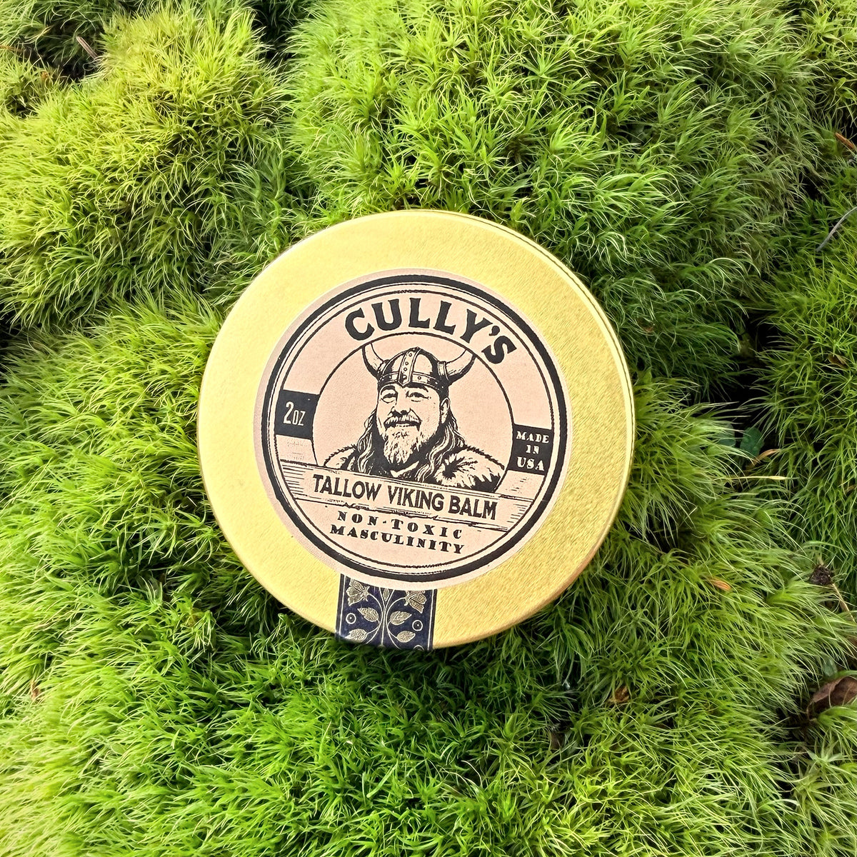 Cully's Tallow Viking Balm tin on moss